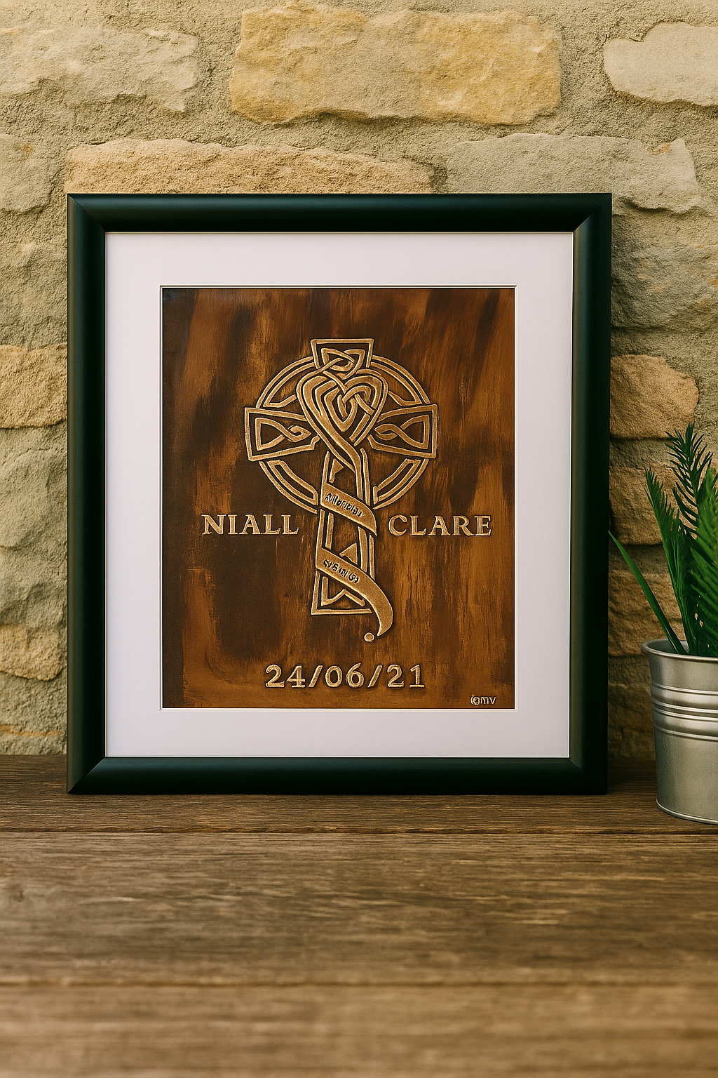 A handcrafted copper Celtic Cross wedding plaque with engraved knotwork and the words “Live Love Laugh,” personalized with names and date, displayed on a stone wall in a cozy rustic home.