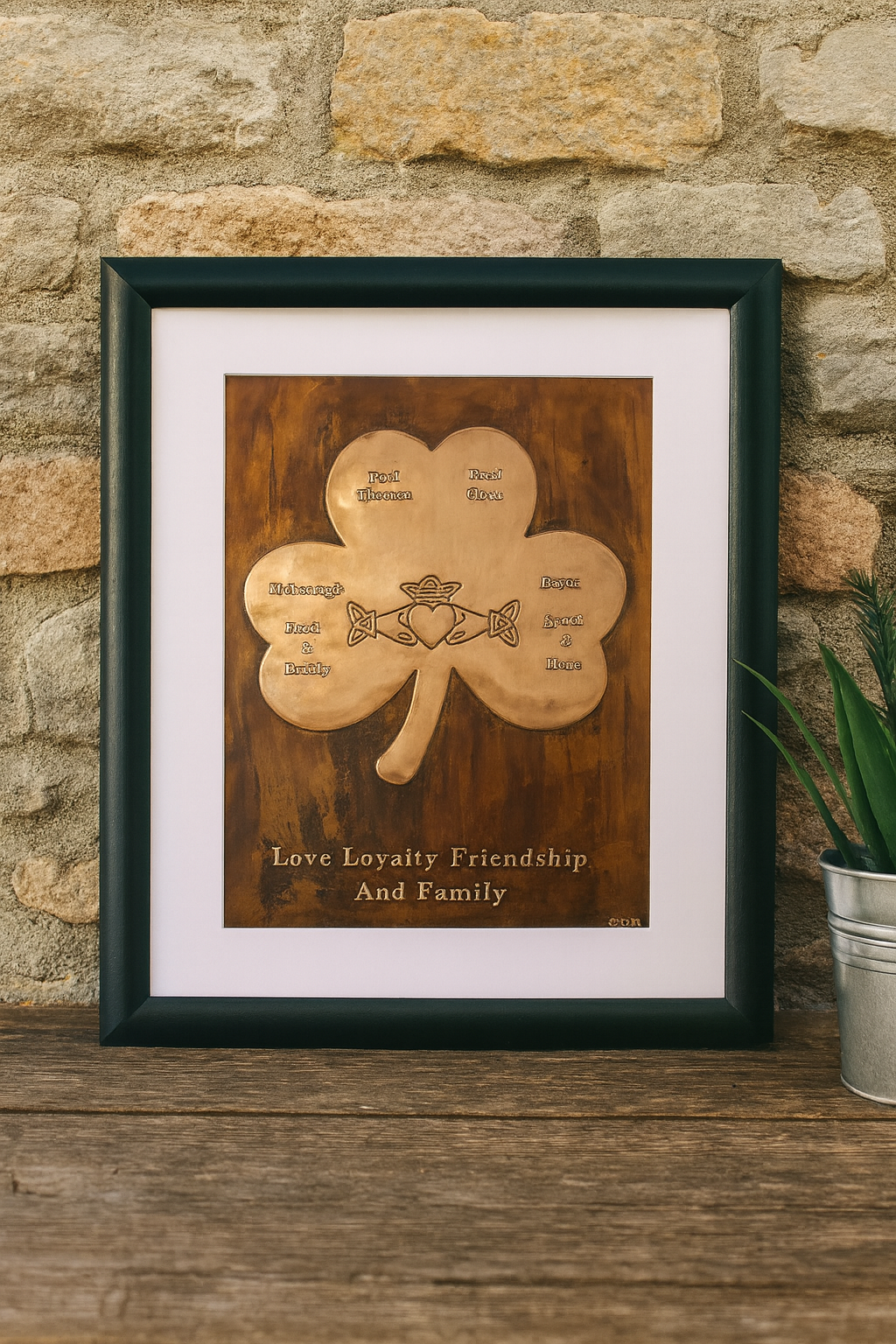 A beautifully framed copper shamrock plaque with the Claddagh symbol, displayed on a rustic living room wall, adding warmth and meaning to the space.