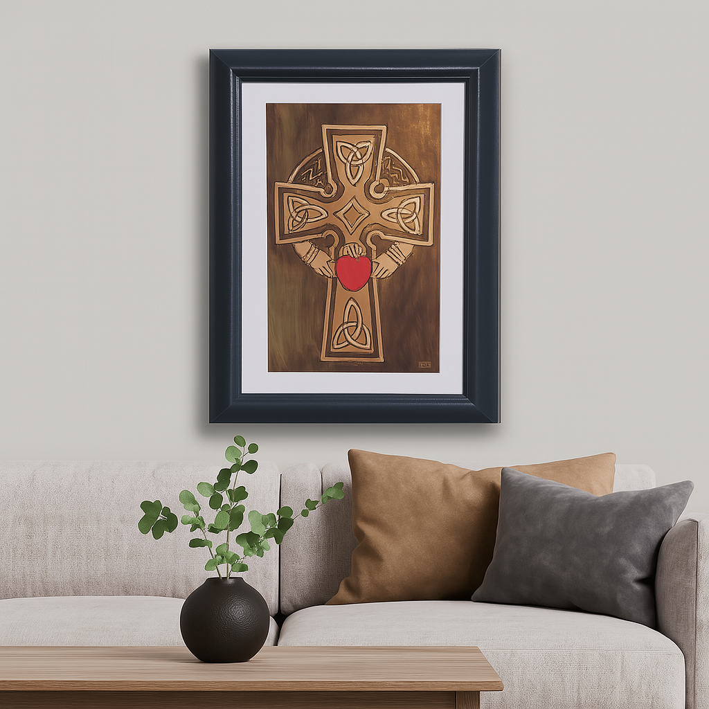 Framed handcrafted copper Celtic Cross with Sacred Heart displayed in a modern living room above a neutral sofa with decorative cushions and a wooden table.