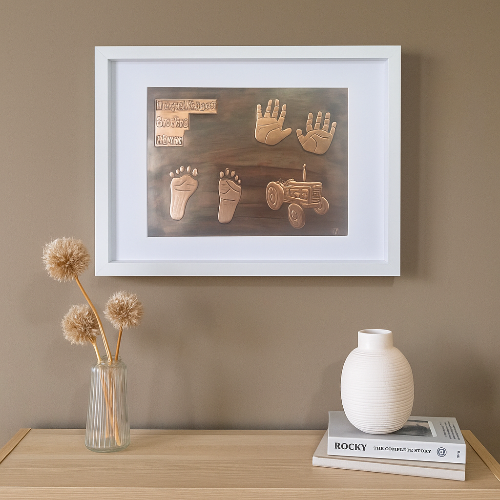 Handcrafted copper baby keepsake with handprints, footprints, birth details and tractor design in white frame