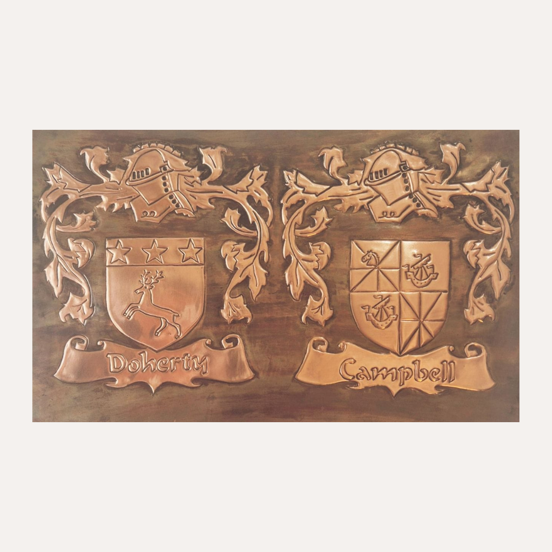Handcrafted copper plaque featuring Doherty and Campbell family crests with ornate detailing and scroll banners