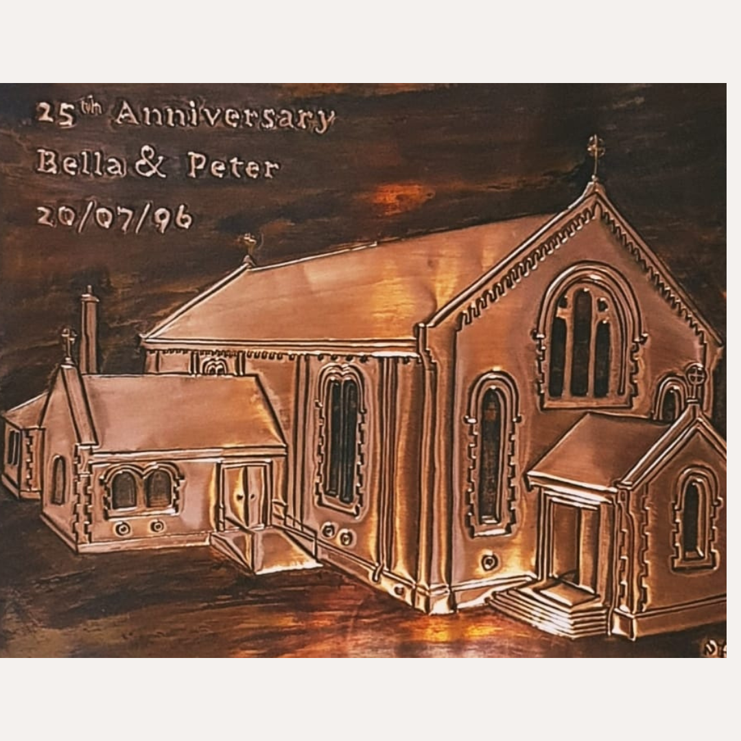 Personalised handcrafted copper anniversary plaque featuring a church portrait with engraved names, date, and 25th-anniversary inscription, framed in wood.