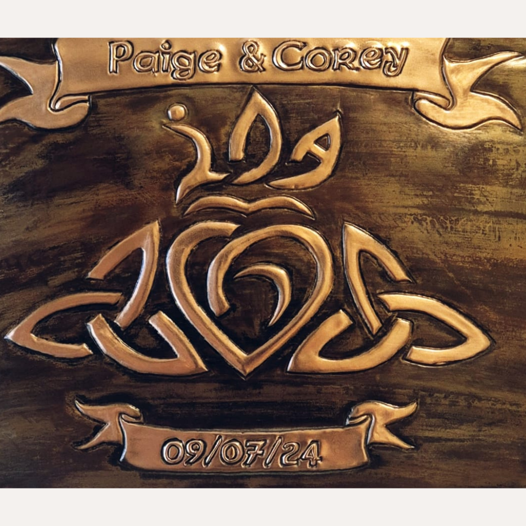 Handcrafted copper wedding plaque with Celtic knot heart design, personalised with names Paige & Corey and date 09/07/24 in ivory frame – Irish-made gift