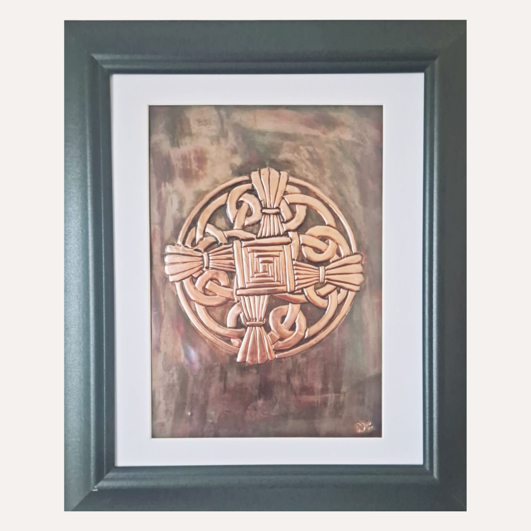 This handcrafted copper depiction of St. Brigid’s Cross blends Celtic knotwork with traditional symbolism.