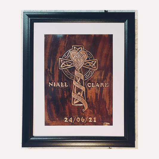 Handcrafted copper artwork featuring a Celtic Cross design with detailed knotwork and the inscription 'Live Love Laugh,' personalized with names and a wedding date.