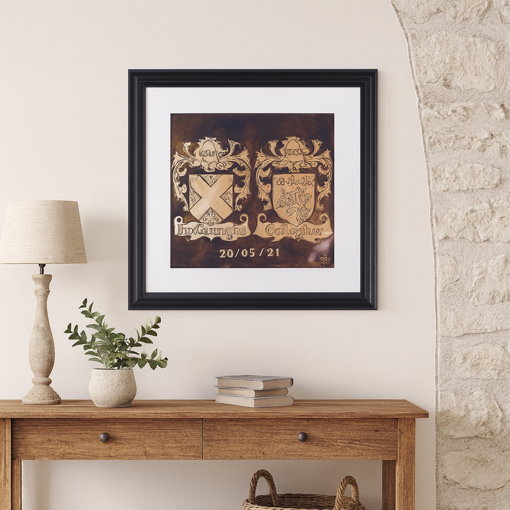 Handmade copper double family crest plaque of McGarrigle and Gallagher displayed on a wooden shelf, framed and engraved with a special date.