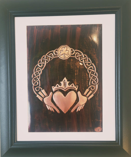 Handcrafted copper artwork featuring a traditional Claddagh design with a crowned heart and hands, surrounded by intricate Celtic knotwork, symbolizing eternal love, loyalty, and friendship.