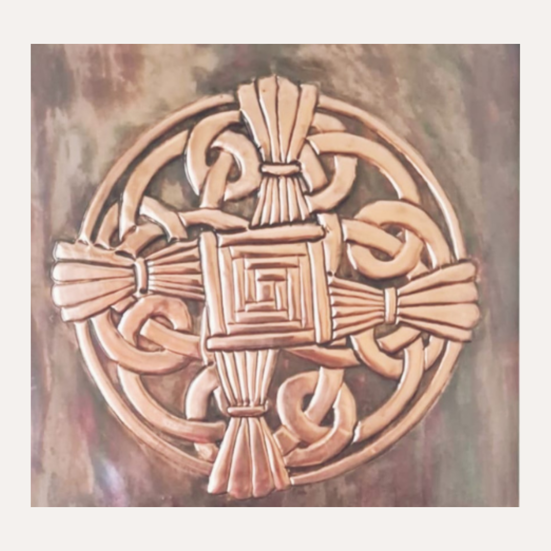 This handcrafted copper depiction of St. Brigid’s Cross blends Celtic knotwork with traditional symbolism.