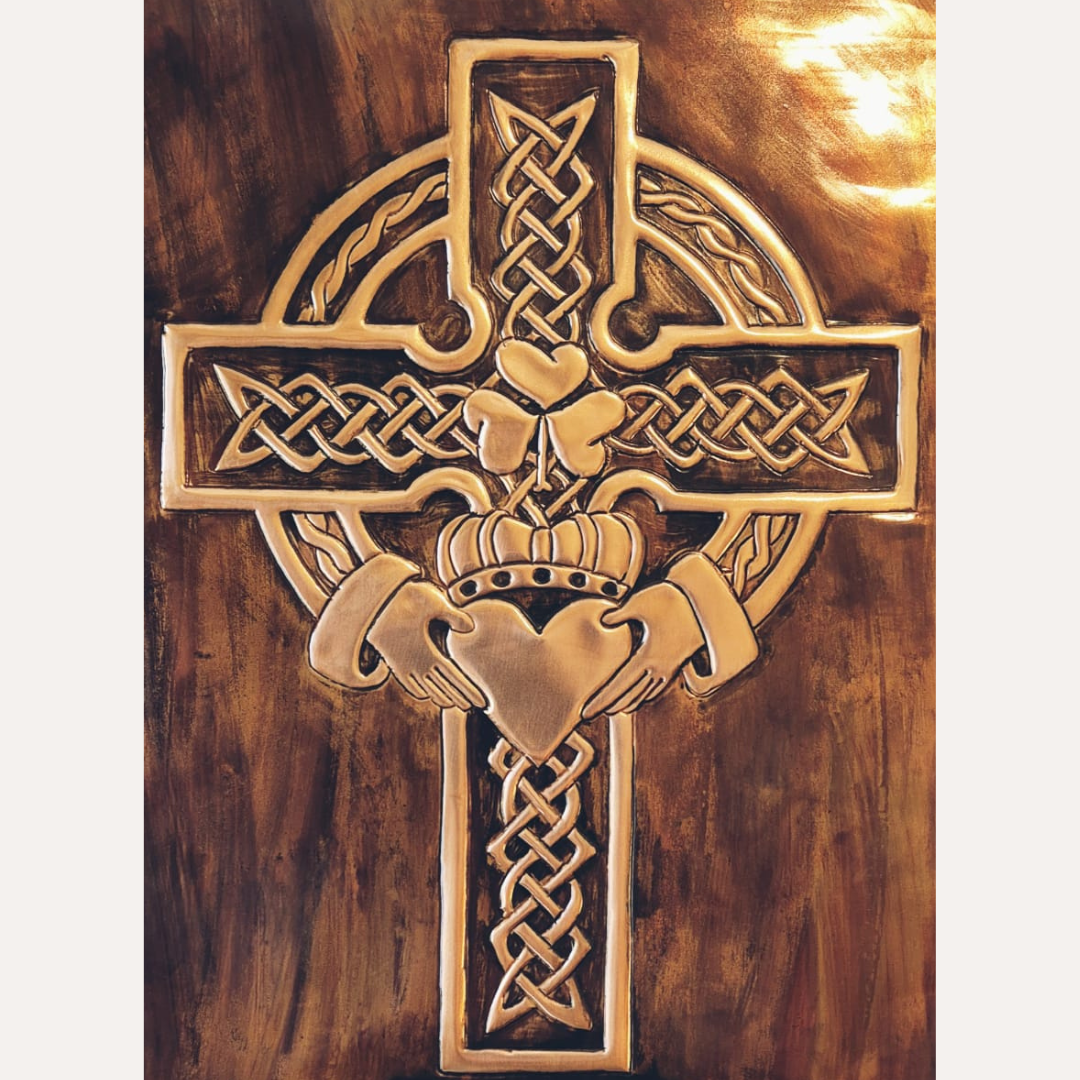 Framed handcrafted copper Celtic Cross with shamrock emblem and intricate Irish knotwork, finished with a rich patina background.