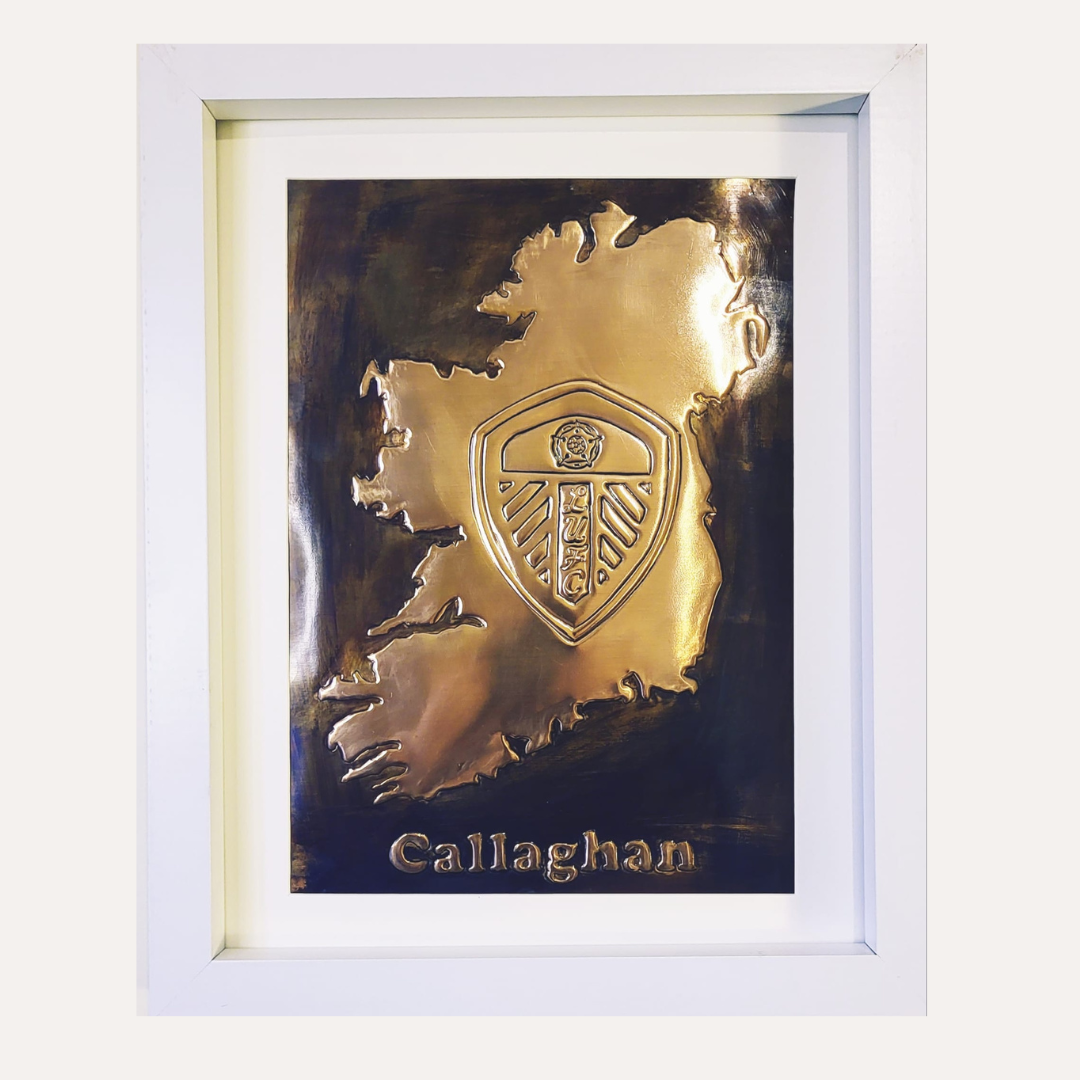 Handcrafted copper artwork featuring the Leeds United crest embossed within a map of Ireland, personalized with the name Callaghan, symbolizing Irish pride and football loyalty