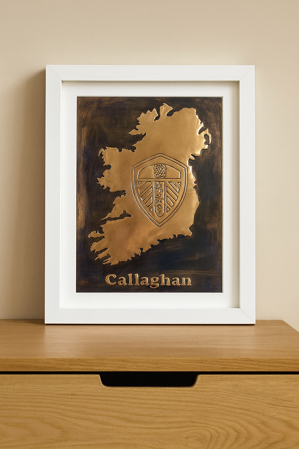 A handcrafted copper artwork featuring the Leeds United crest within a map of Ireland, displayed in a cozy living space on a wooden wall, symbolizing Irish pride and unwavering football loyalty.