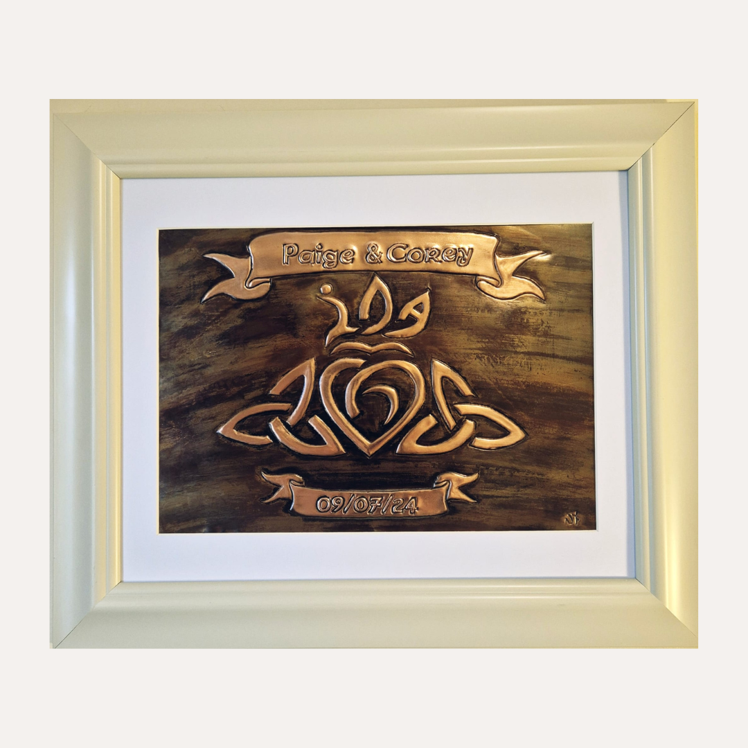 Handcrafted copper wedding plaque with Celtic knot heart design, personalised with names Paige & Corey and date 09/07/24 in ivory frame – Irish-made gift