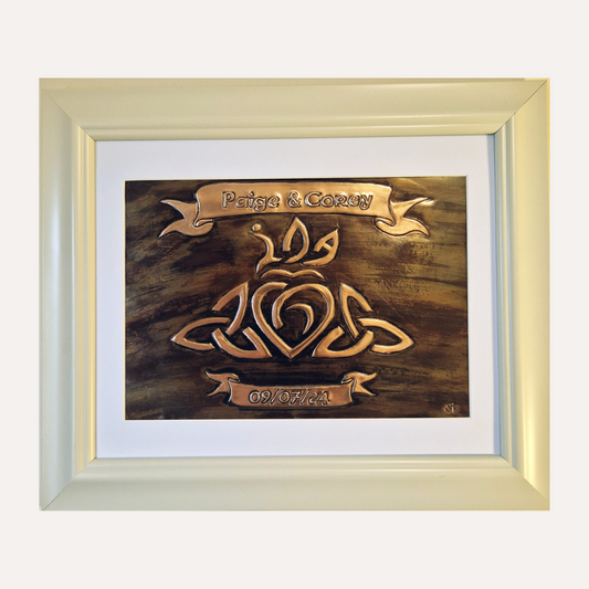 Handcrafted copper wedding plaque with Celtic knot heart design, personalised with names Paige & Corey and date 09/07/24 in ivory frame – Irish-made gift