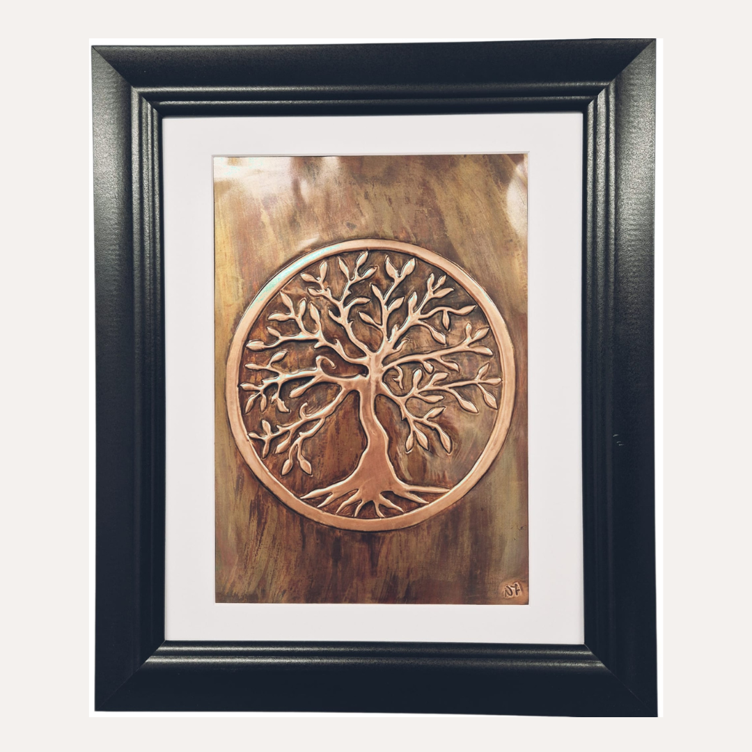 The Tree of Life symbolises connection, balance, and continuity. Its roots represent grounding, heritage, and our connection to the past; the trunk signifies strength and personal growth; and the branches reaching upward reflect renewal, hope, and the link between earth, sky, and spirit.