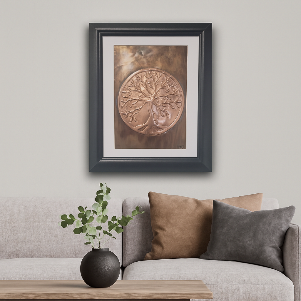 Framed handcrafted copper Tree of Life artwork displayed in a modern living room with neutral décor and soft furnishings.